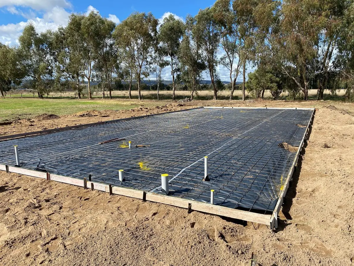 Steel mesh laid on plastic and boxed up ready for a shed slab pour on a rural block
