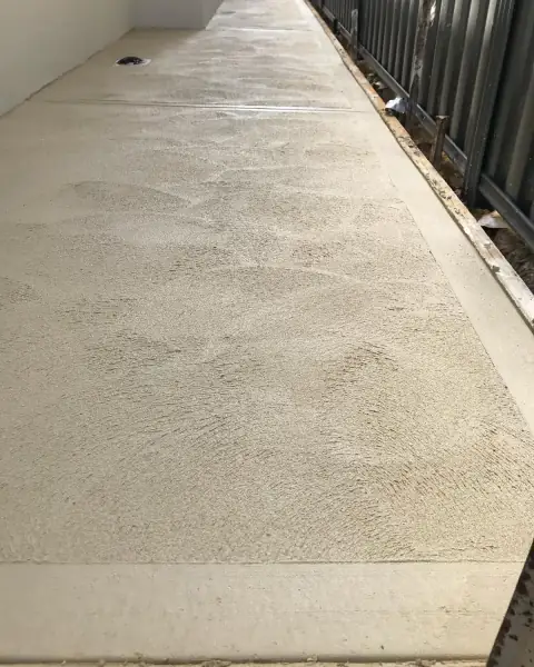 Textured liquid limestone side path with a smooth border down each side